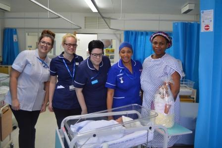 Baby David with mum Julieth and staff from ward 9