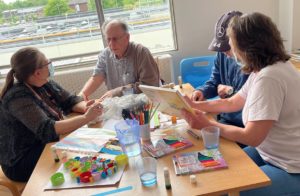 A photo of patients and staff undertaking meaningful activities
