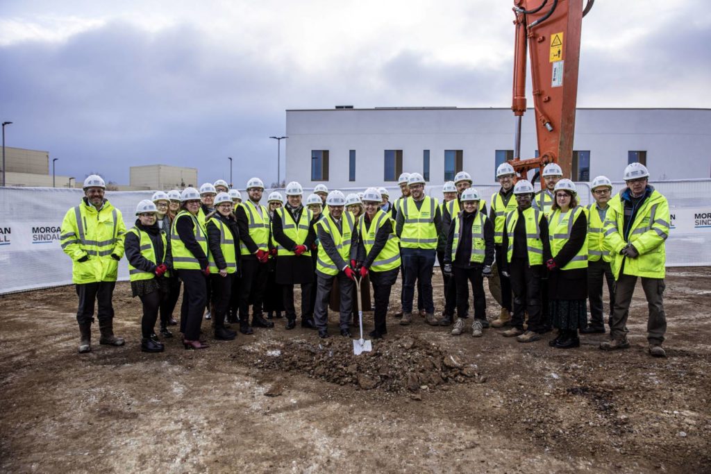 Individuals gathered for the ground-breaking of the new Radiotherapy Centre