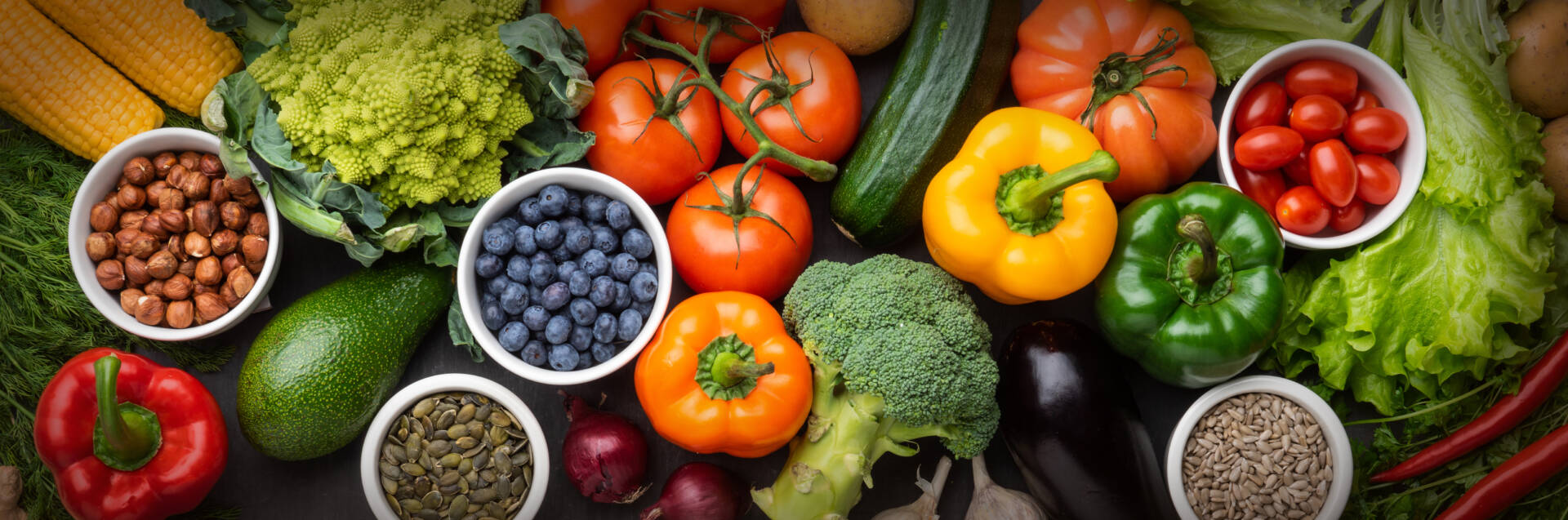 Healthy eating ingredients: fresh vegetables, fruits and superfood. Nutrition, diet, vegan food concept. Concrete background.